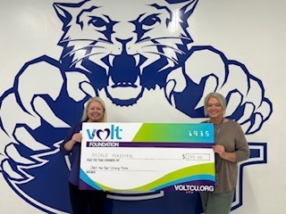 Mrs. Forester holding a Volt Foundation Check