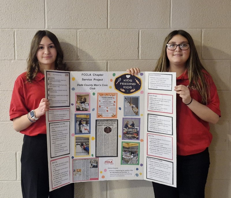 image of Lakely and Lashay Brown with their Chapter Service Project Display