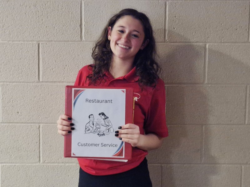 image of Ezabella Vesco with her Restaurant Customer Service portfolio