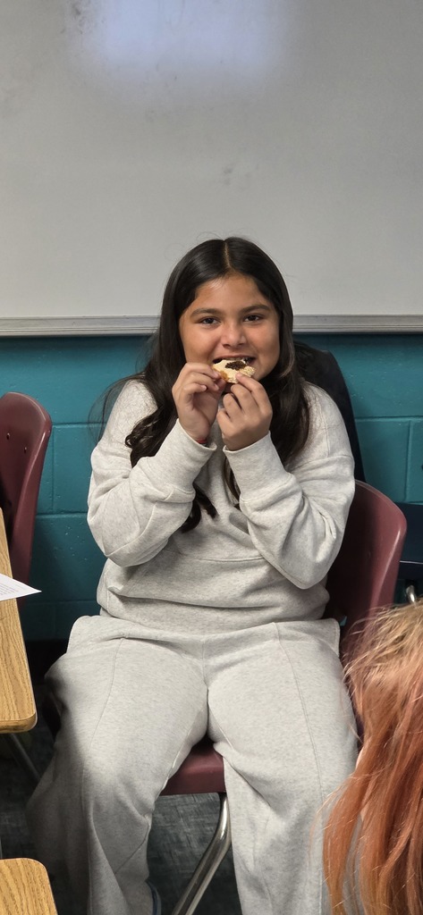 student trying molasses and tea