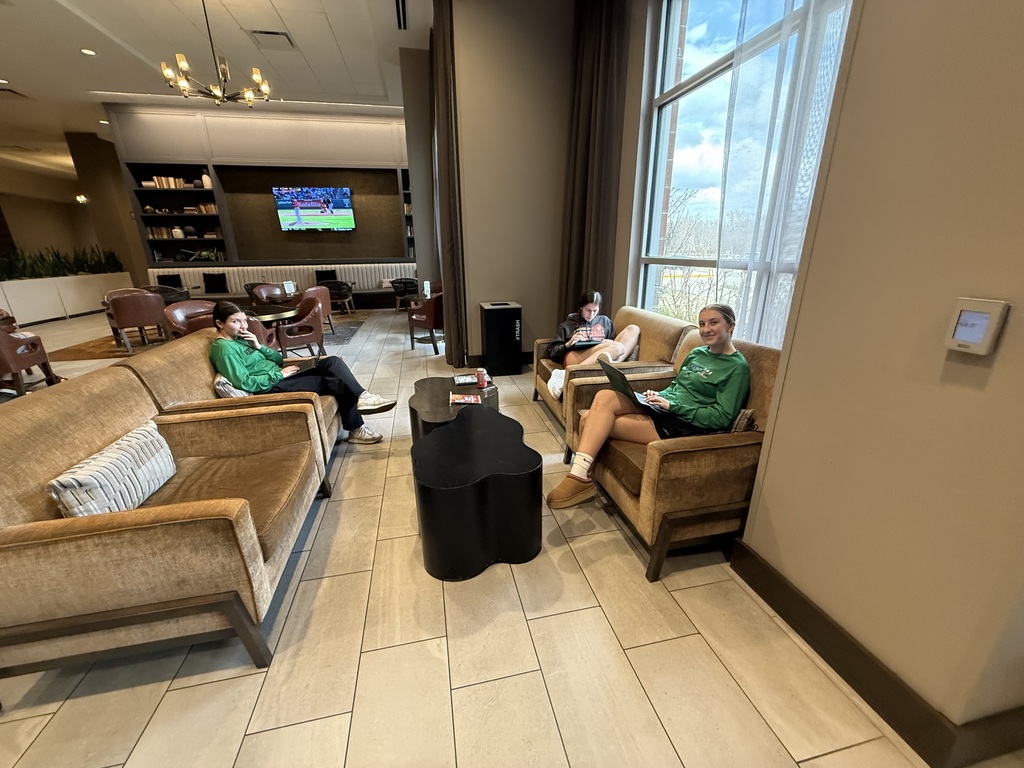 students studying in motel lobby at state