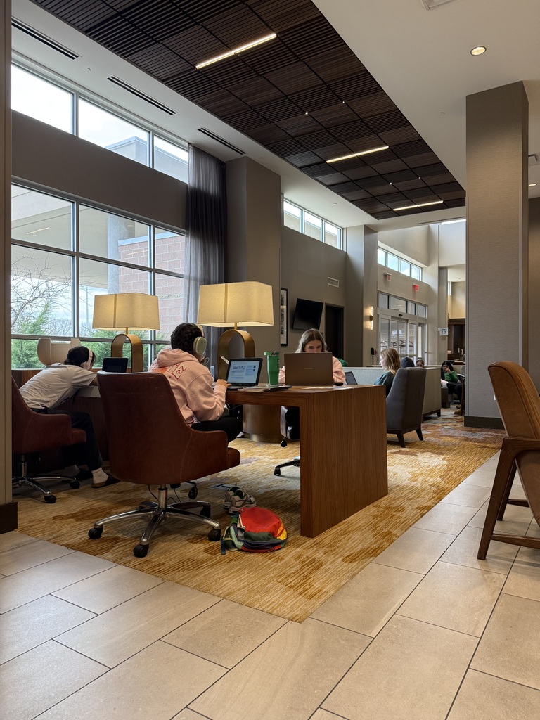 students studying in motel lobby at state