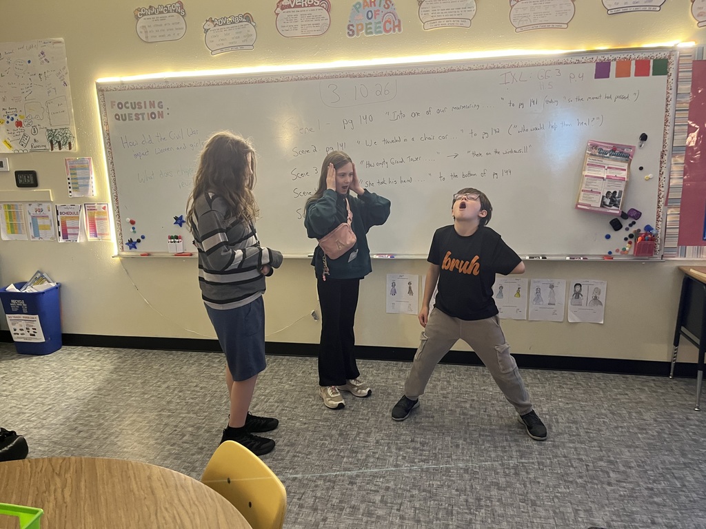 three students in classroom