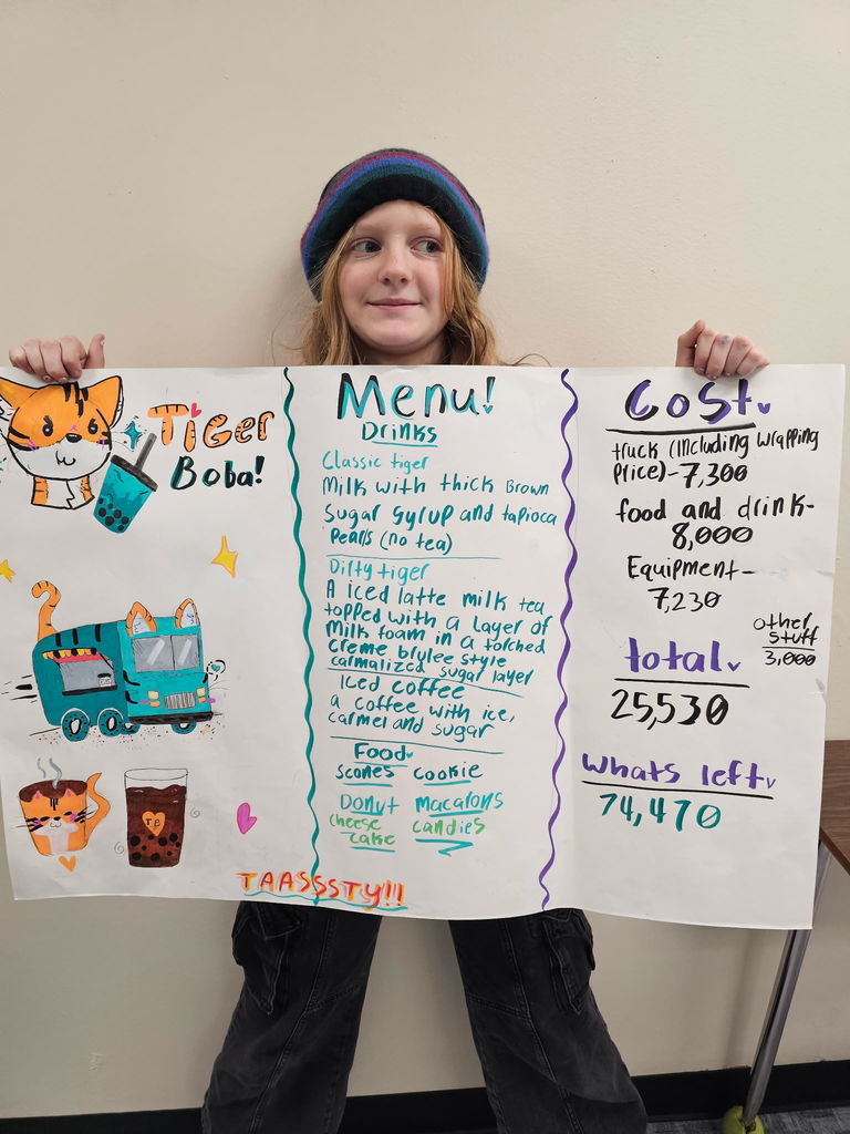 student holding up a menu to tiger boba