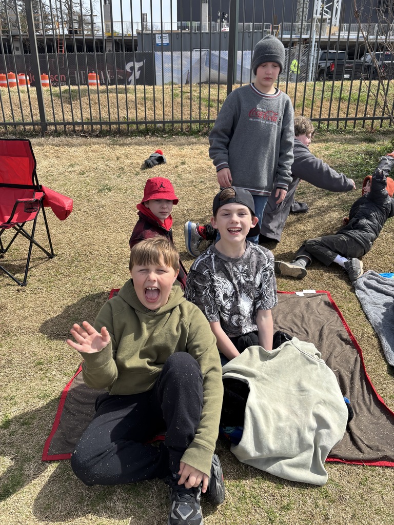 students spectating at the lady razorback softball game