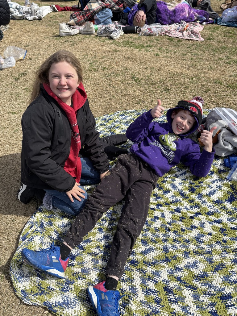 students spectating at the lady razorback softball game