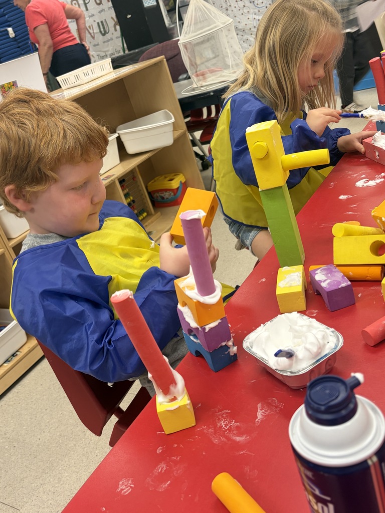 preschool student building a treehouse with blocks