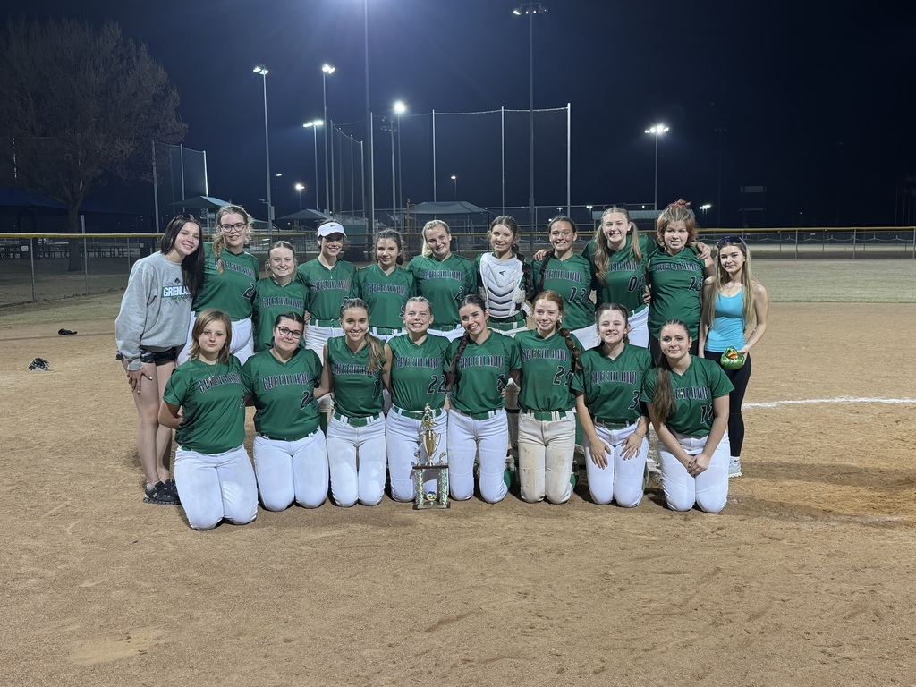 lady pirate softball team posing after 3rd place win at blazer blast tournament
