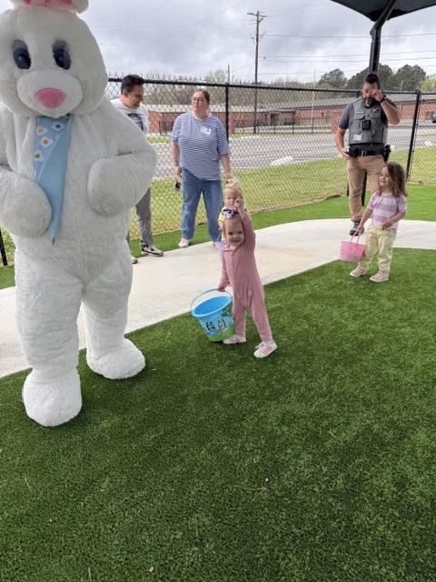 students hunting easter eggs