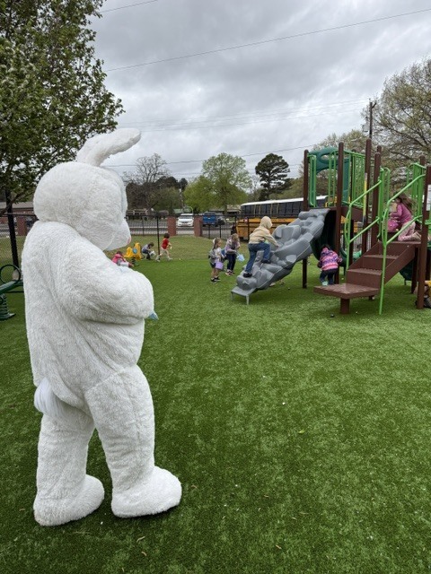 students hunting easter eggs