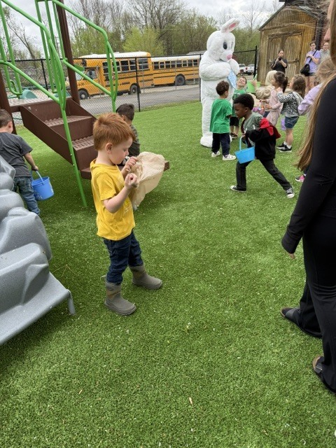 students hunting easter eggs