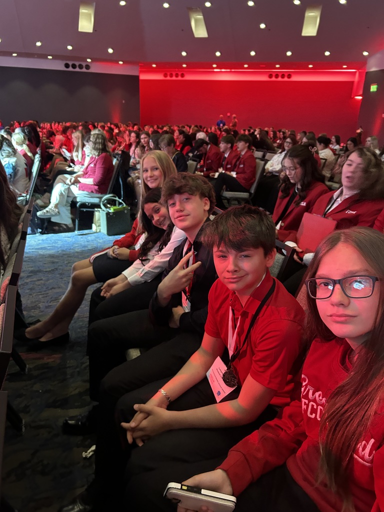 students sitting in an audience