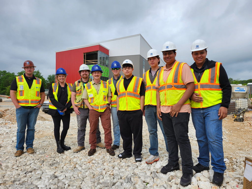 students standing in front of a construction site