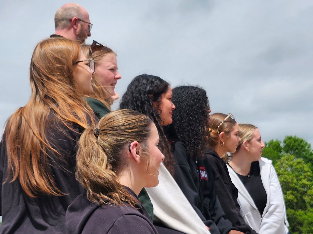 seven students looking in the same direction