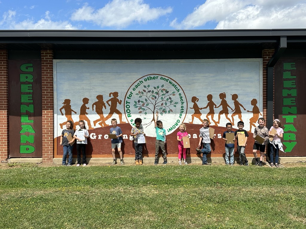 students standing in front of school