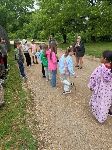 group of students listening to a tour guide