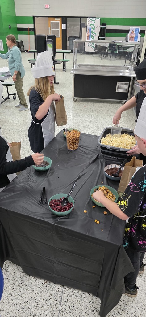 students putting food in a bag