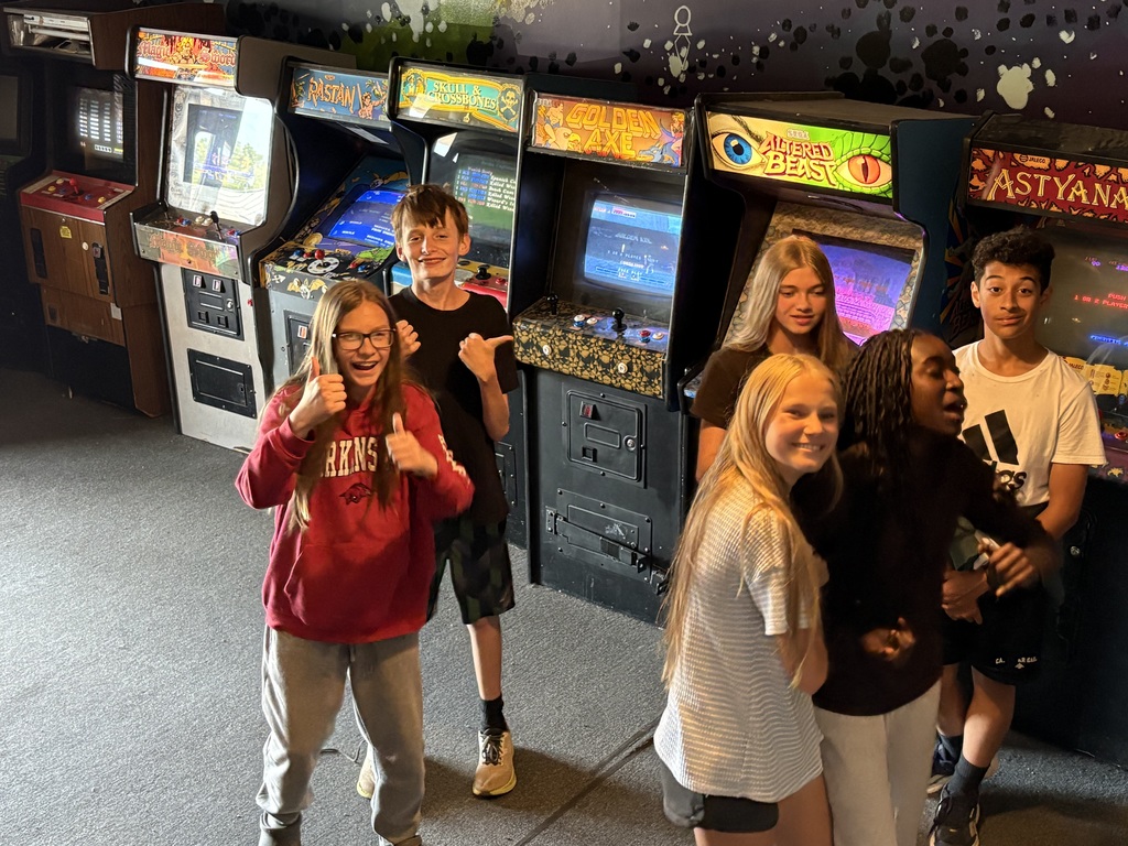 students standing in front of video games