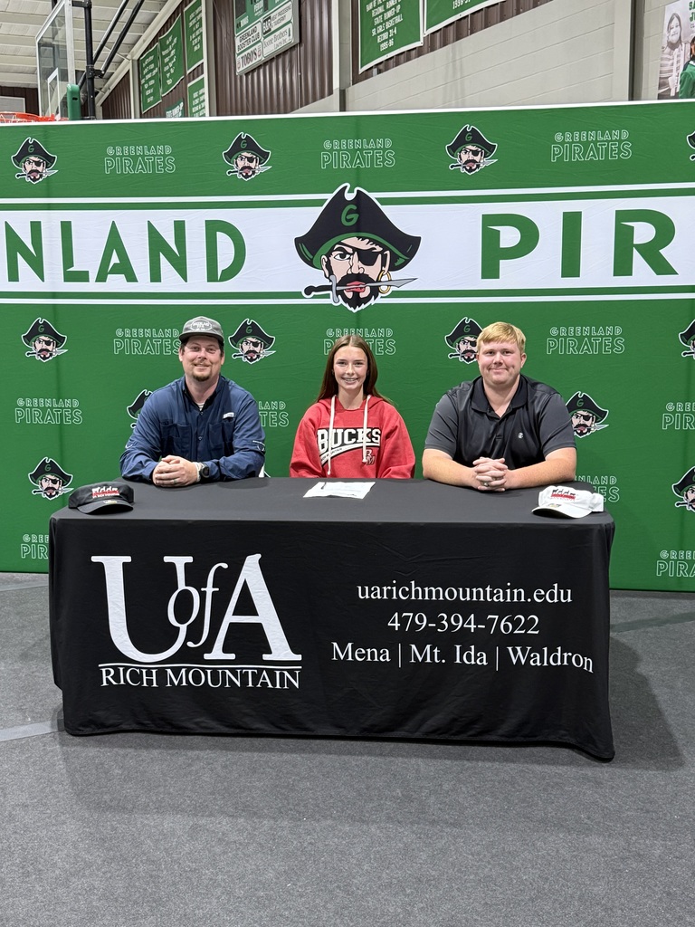 three people at a table that says uofa rich mountain and greenland backdrop