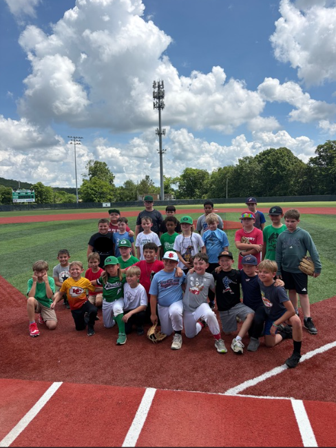 students lined up on baseball field