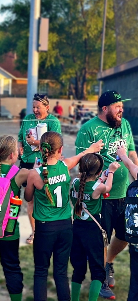 softball team celebrating