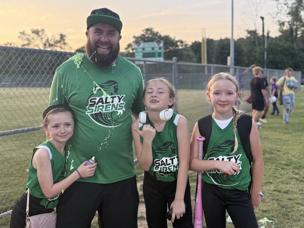 softball team celebrating