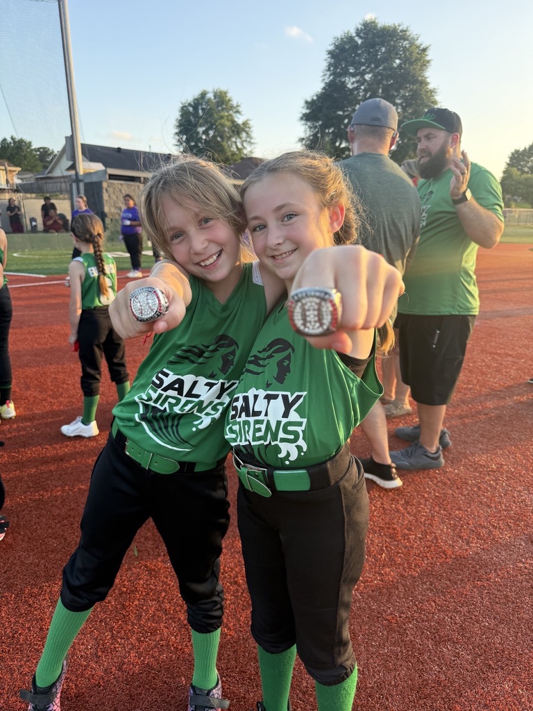 softball team celebrating