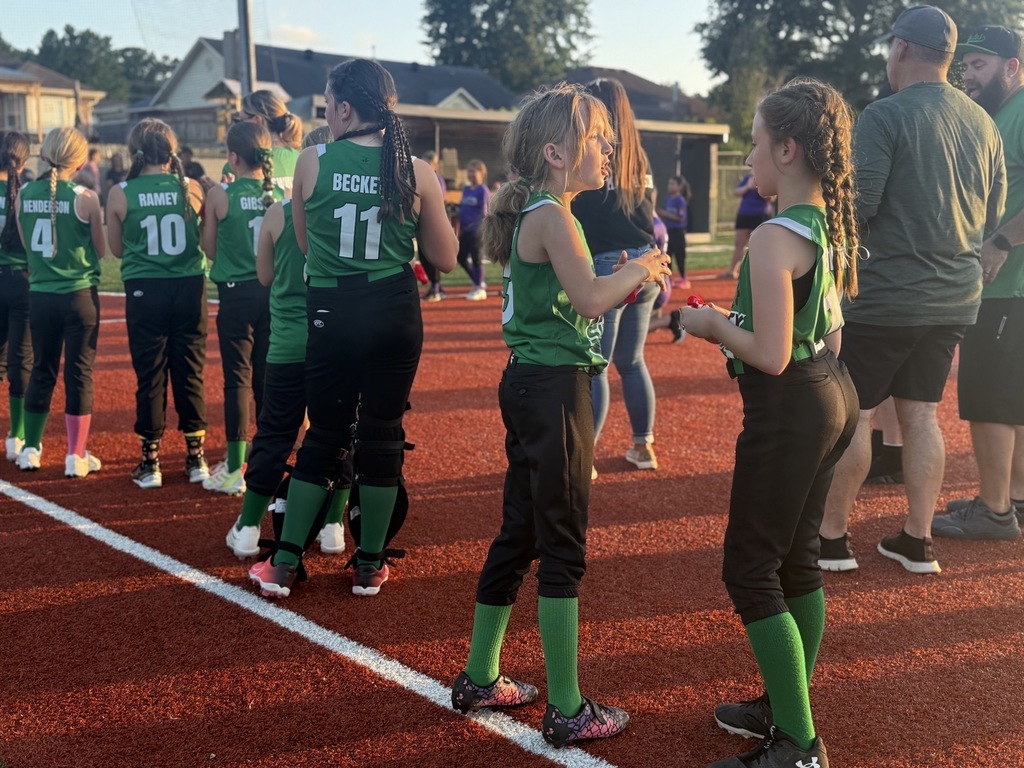 softball team celebrating