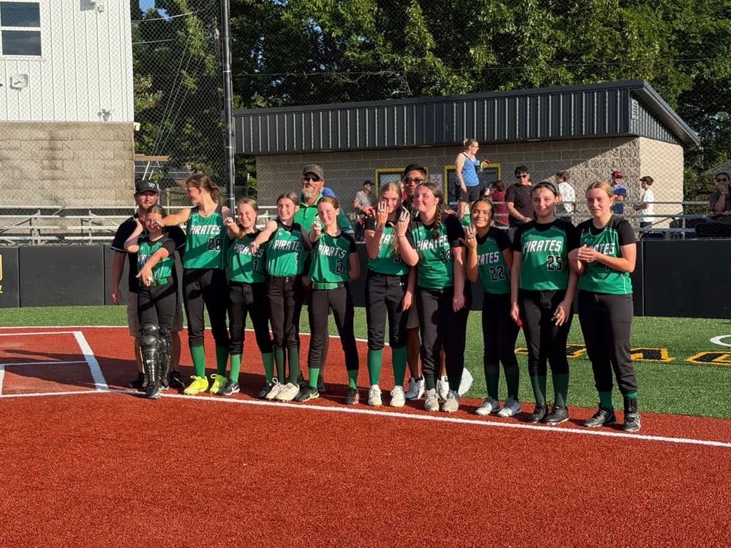 softball team celebrating