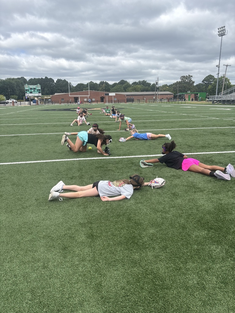 Athletes catching softballs