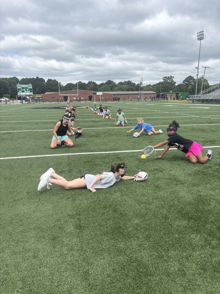 Athletes catching softballs