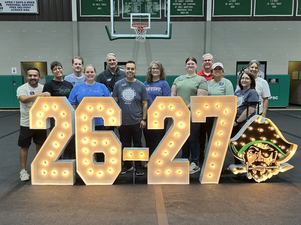 26-27 and pirate sign with group standing behind