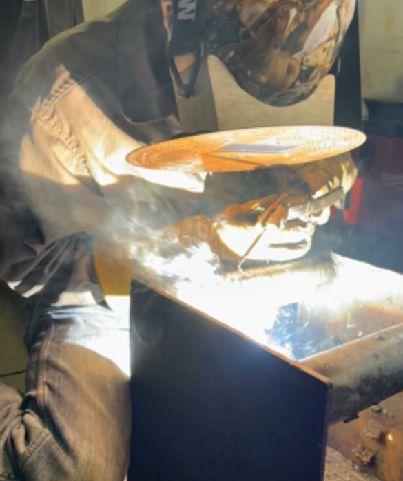person welding