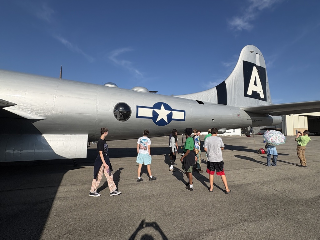 people looking at an airplane