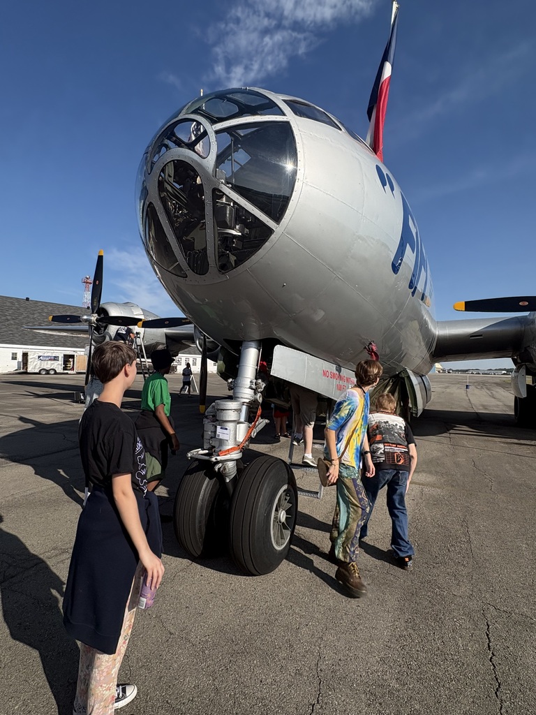 people looking at an airplane