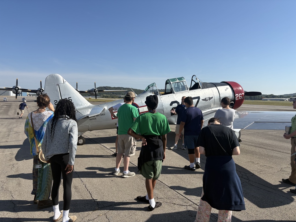 people looking at an airplane