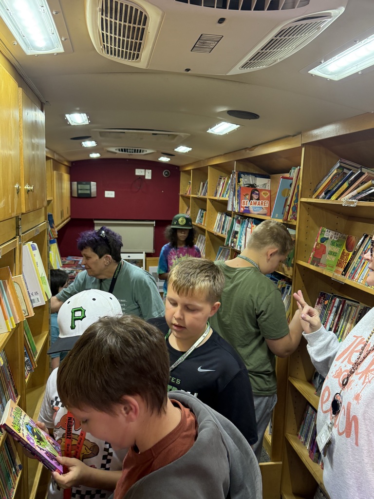 students picking out books