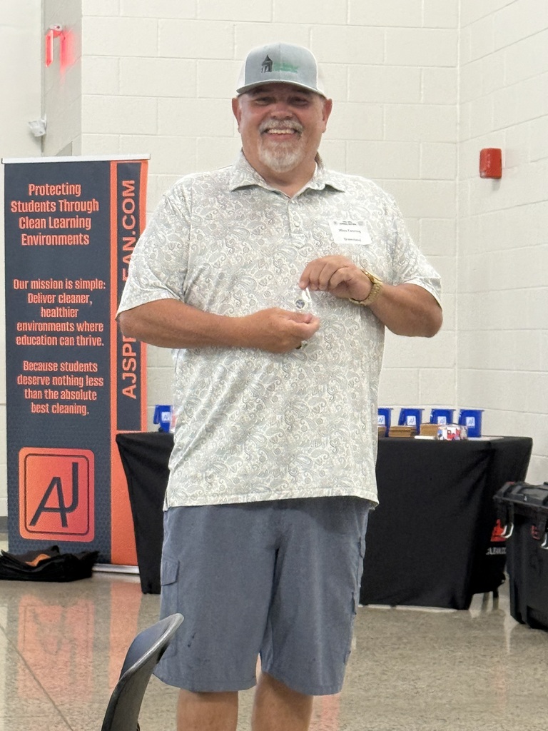 man standing holding a pin