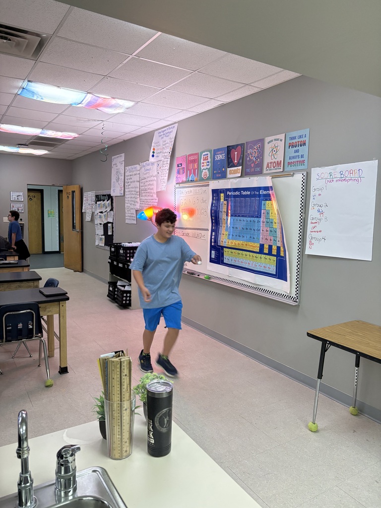 student standing in classroom
