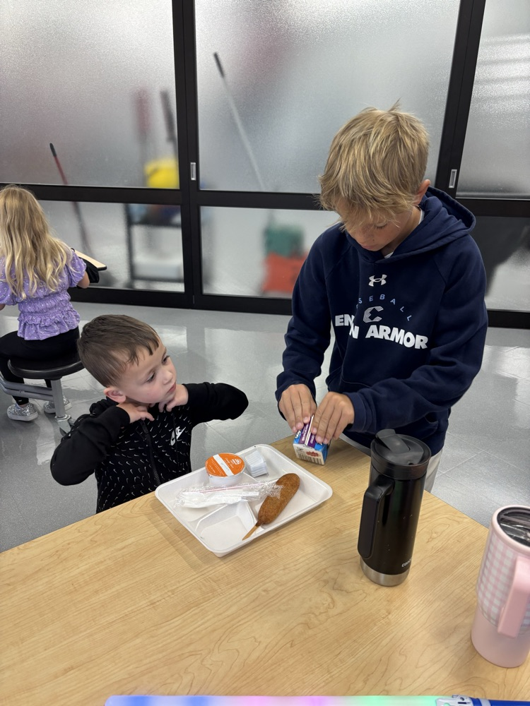 older student helping younger student