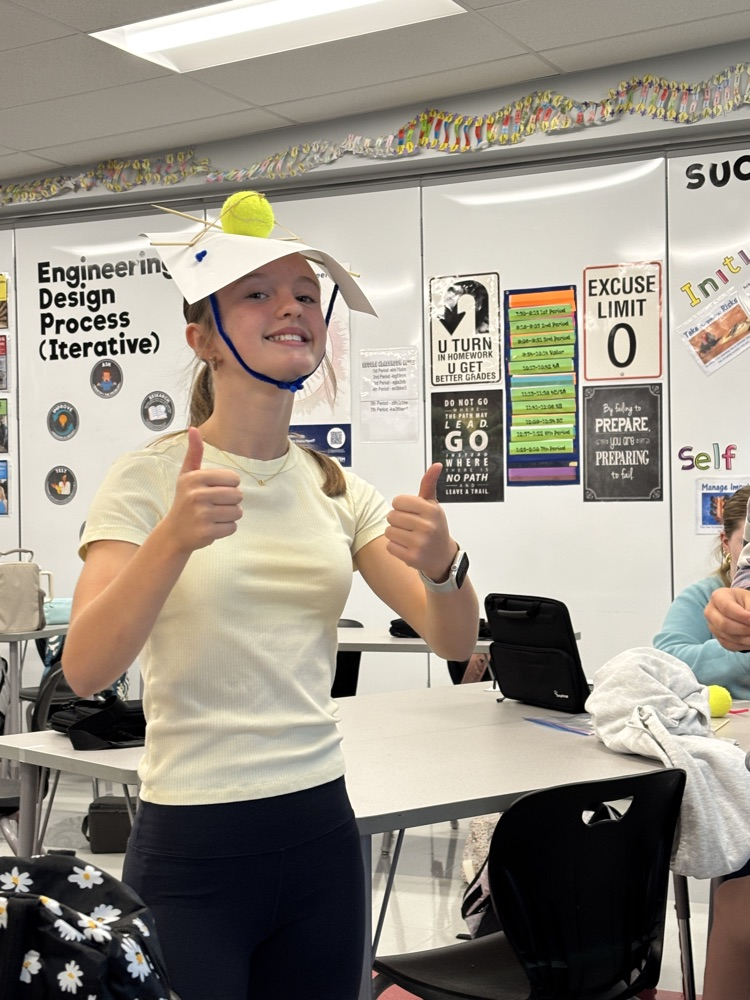 student with apple on head 