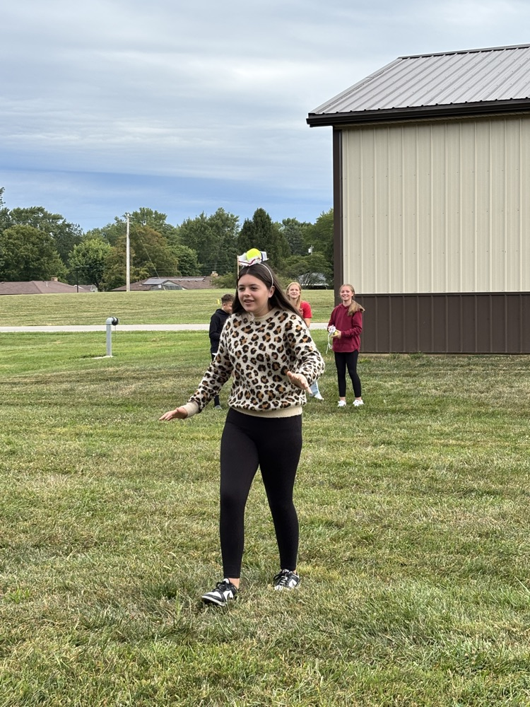 student racing with Apple on head