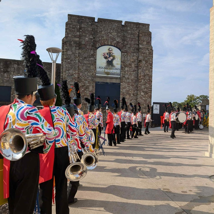 band members lined up ready to go into stadium