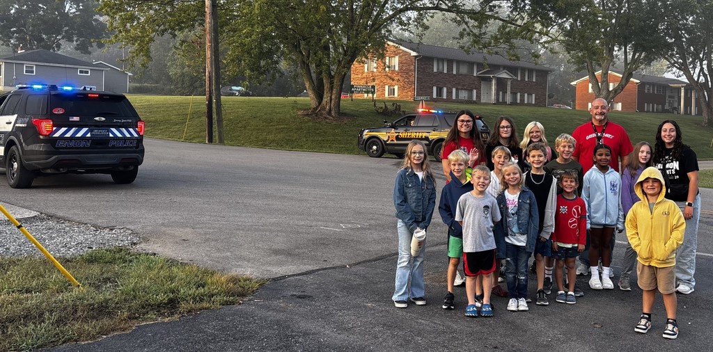 Students with principal with police escort walking to school!
