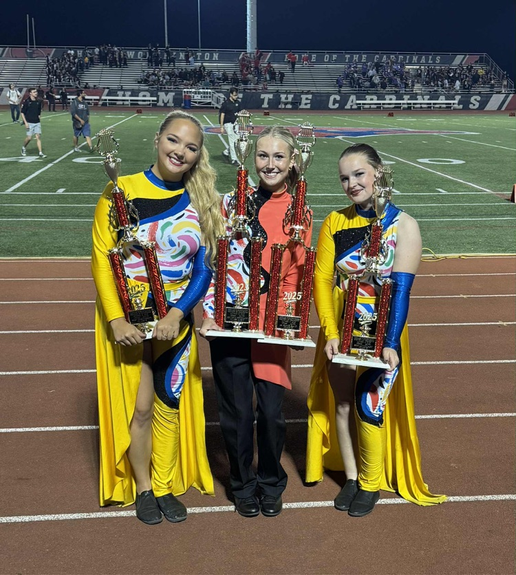 band members with trophies