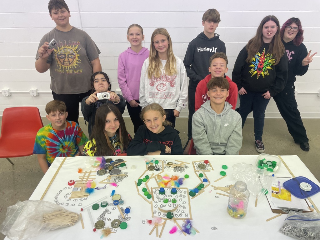 students looking at art and smiling