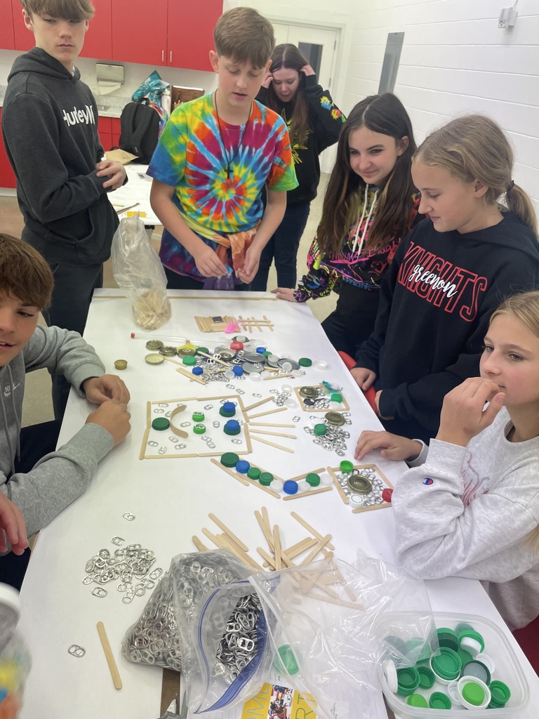 students looking and creating art