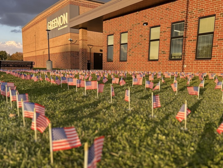 flags outside building in grass