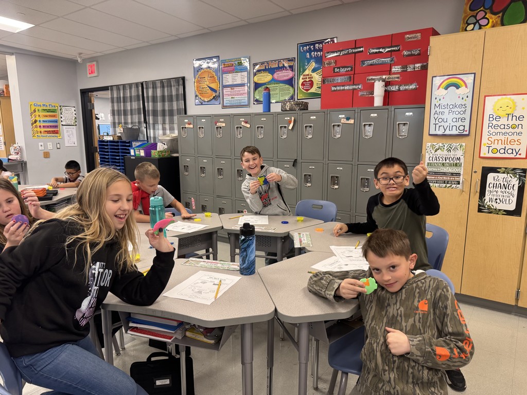 students in a classroom with science experiment