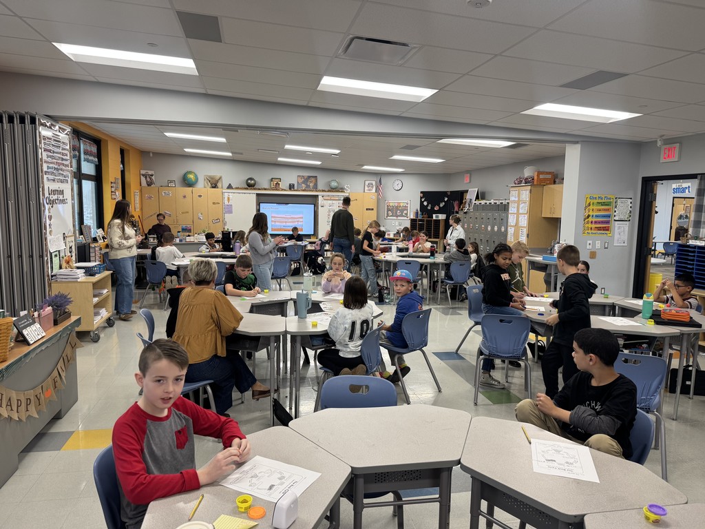 students in a classroom with science experiment
